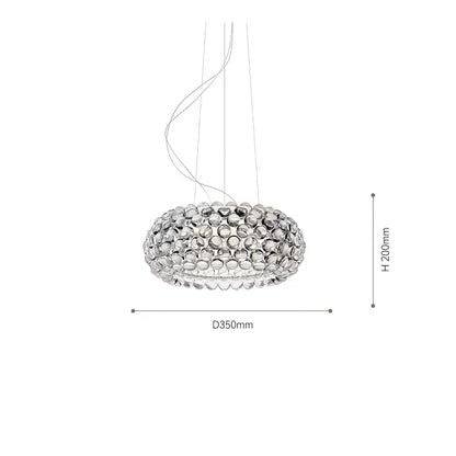 Modern gold acrylic rs7 bulb pendant lights with clear glass orbs in a circular dining room chandelier design