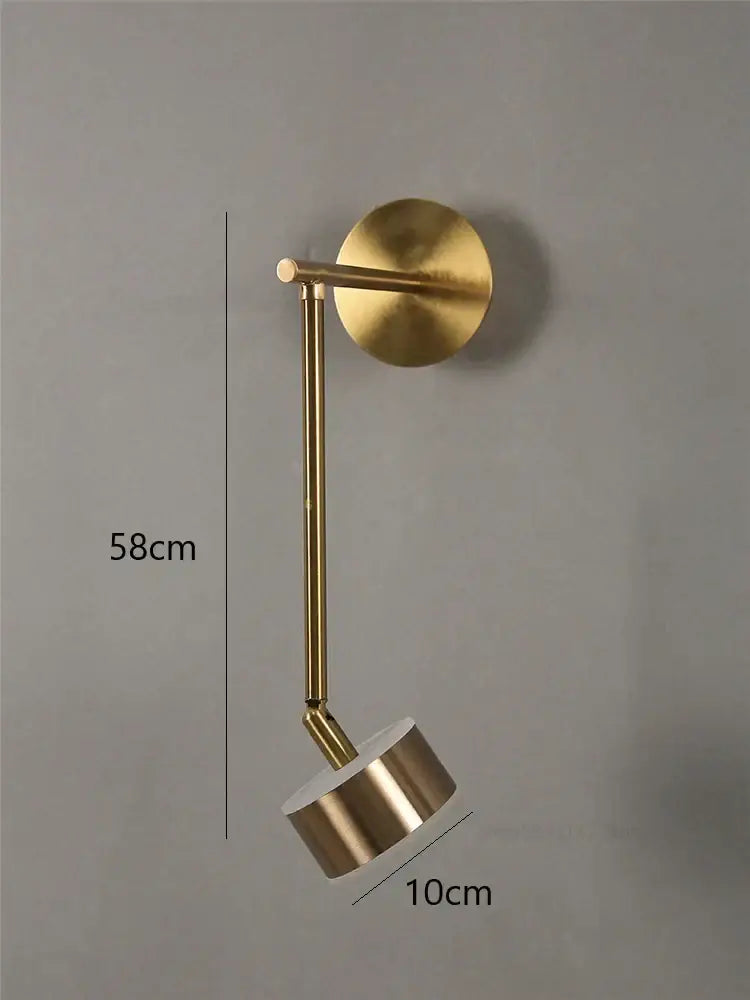 Modern gold adjustable direction wall lamp with cylindrical spotlight head and circular base for bedroom wall light decorbites