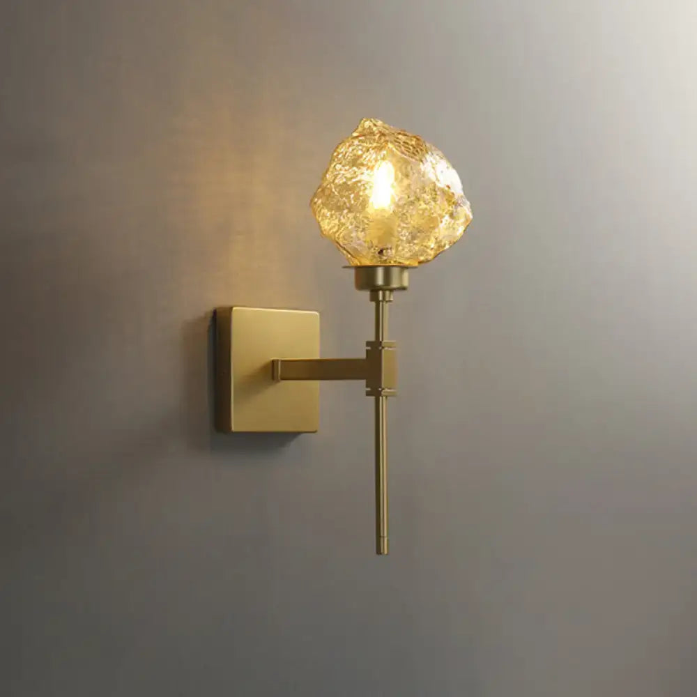 Modern gold amber smoke gray glass wall sconce with textured amber globe for living room lighting