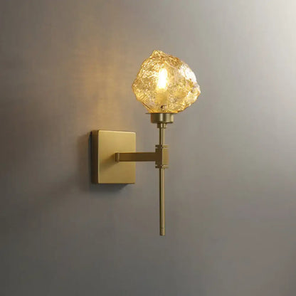 Modern gold amber smoke gray glass wall sconce with textured amber globe for living room lighting
