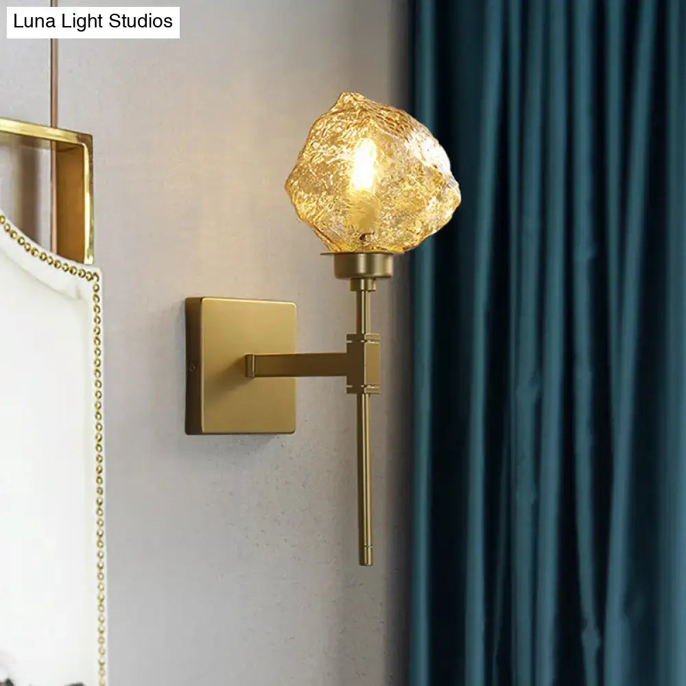 Modern gold amber smoke gray glass wall sconce with textured amber gold globe for living room lighting