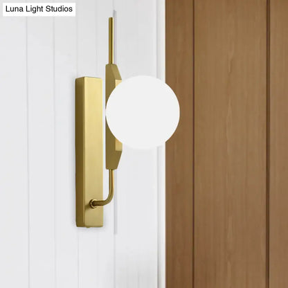 Modern gold and amber glass orb light fixture with frosted glass shade and rectangular backplate for 110v-120v use