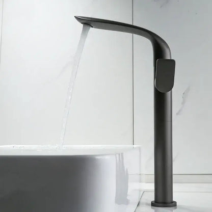 Modern gold and black decorbites basin faucet with a sleek curved matte black design and tall cylindrical body