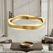 Modern gold and black circle chandelier pendant light with sleek intertwined ring design for dining room decorbites black circle