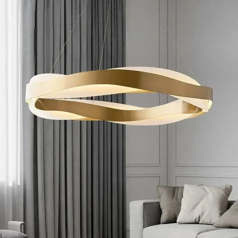 Modern gold and white twisted ring pendant light fixture complementing decorbites black circle chandelier for dining room decor