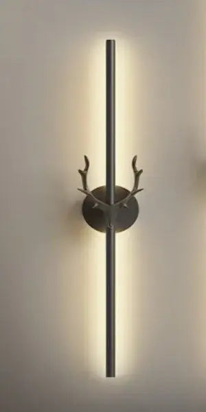 Modern minimalist wall lamp with matte black antler-inspired base and vertical bar in decorbites deer horn led design