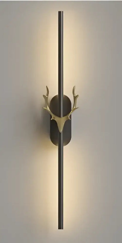 Modern gold and black deer horn led wall lamp with a sleek vertical bar and elegant decorbites deer horn accent