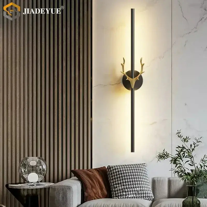 Modern gold and black deer horn led wall lamp featuring gold-toned antler decorbites deer horn with sleek black bar