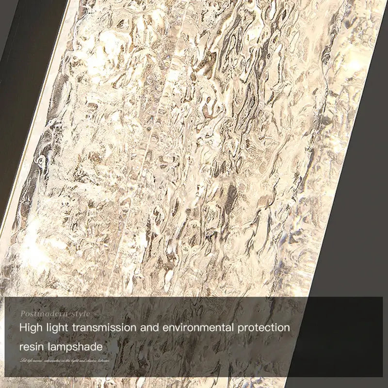 Modern gold and black led bedroom wall lamp with silver-toned resin lampshade featuring a textured wavy surface