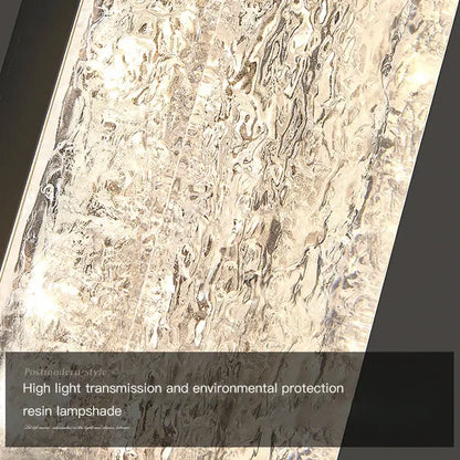 Modern gold and black led bedroom wall lamp with silver-toned resin lampshade featuring a textured wavy surface