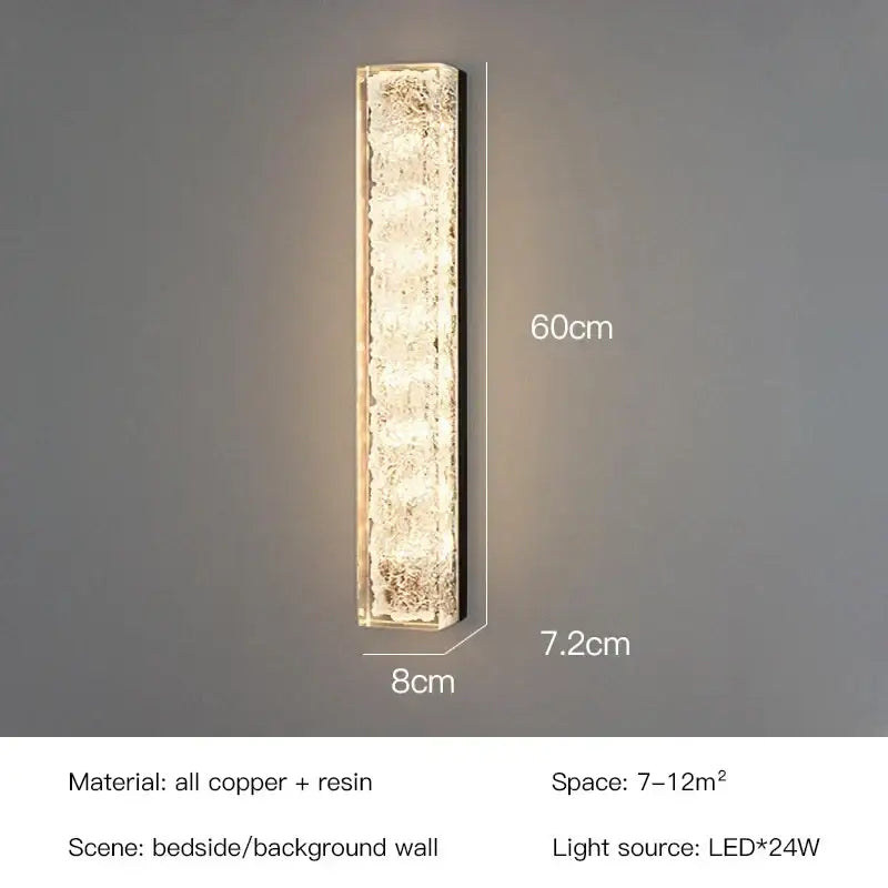 Modern gold and black led bedroom wall lamp with a textured translucent resin body and copper frame wall lamp emitting warm light