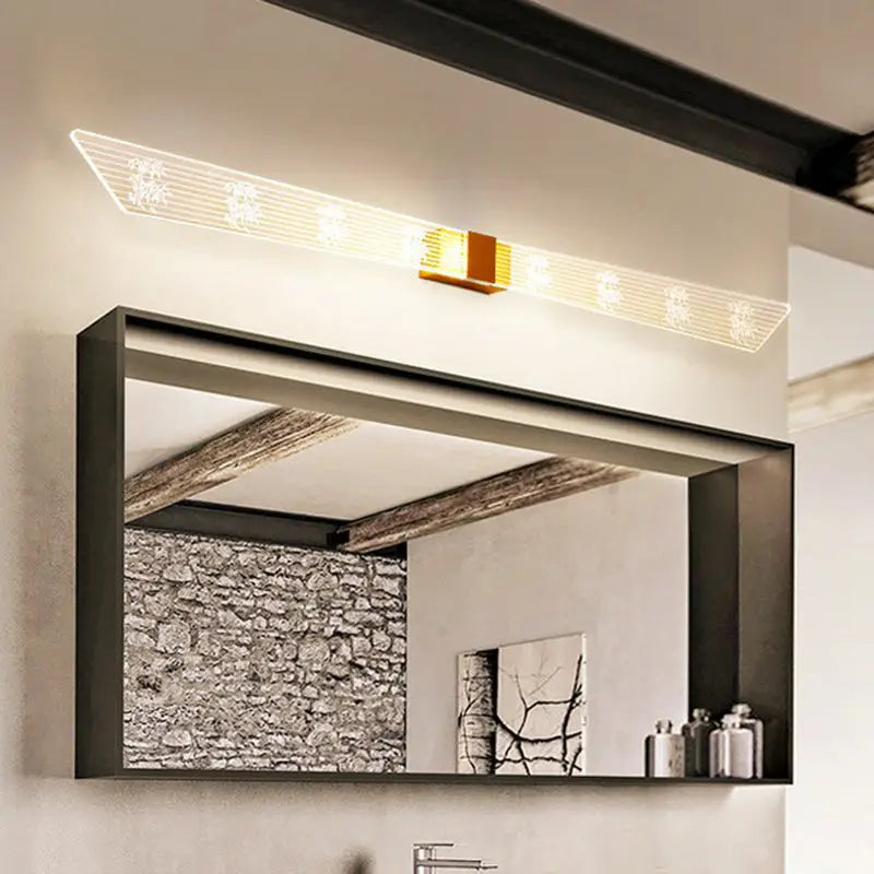 Modern gold and black led vanity sconce light bathroom wall fixture with a sleek black framed rectangular mirror and integrated led light