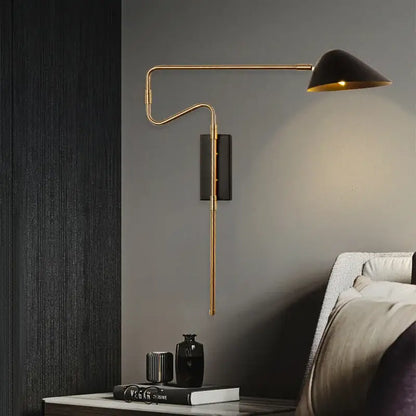 Modern gold and black led wall lamp with sleek curved arm and black conical shade for bedroom lighting