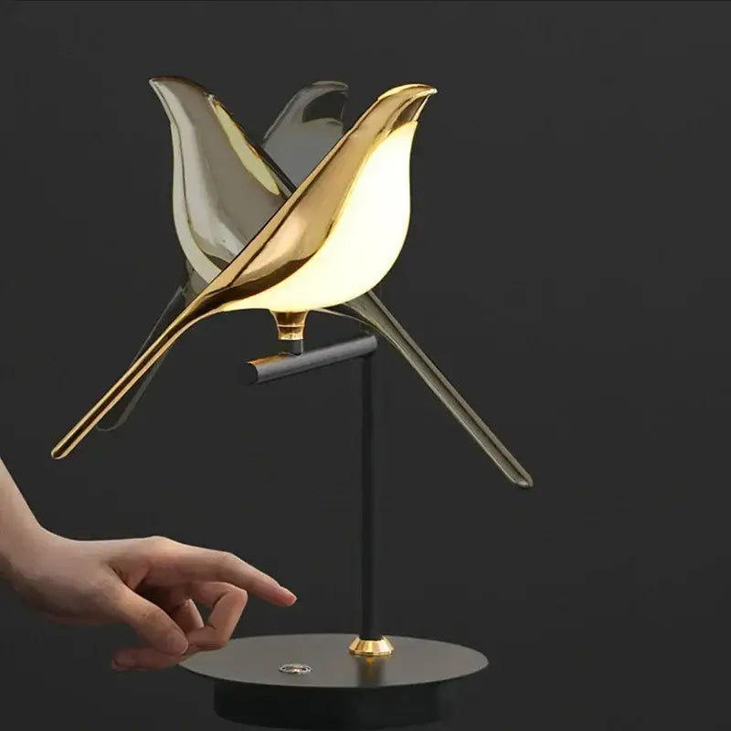 Modern gold and black magpie bird pendant light with sleek iron finish and cord pendant installation in dining room