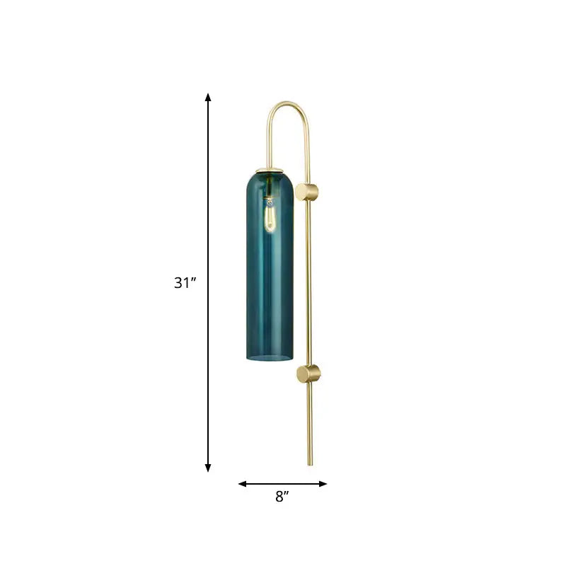 A sleek 31-inch wall lamp with deep teal glass and a slender brass frame, ideal for modern living rooms