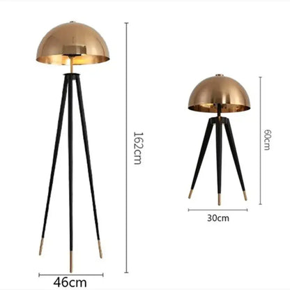 Modern gold and black tripod floor lamp with brass accents for living room decorbites coyote tripod design