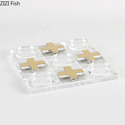 Modern gold and clear acrylic tic-tac-toe chessboard set with gold cross markers for living room decor