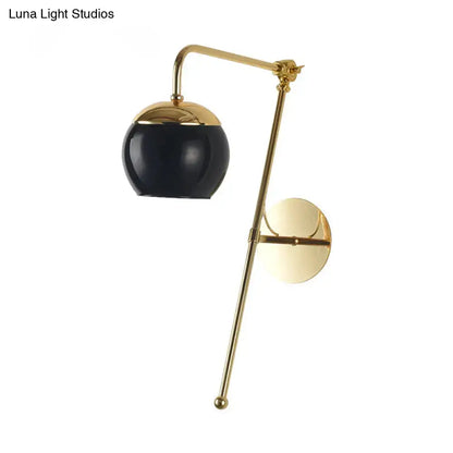Modern gold wall sconce with a clear black glass spherical shade light fixture for bedroom wall lighting