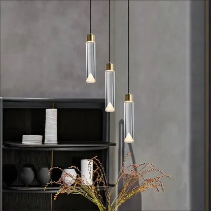 Modern gold and clear crystal copper pendant light with three clear glass cylinders and warm white led bulbs for dining room decorbites clear crystal