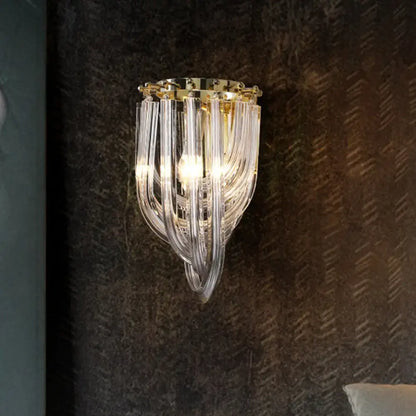 Elegant modern gold and clear glass geometric wall sconce with curved transparent tubes for living room lighting