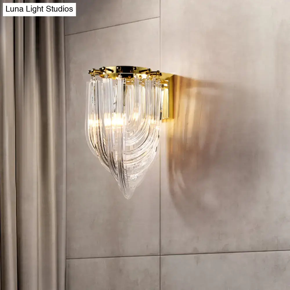 Modern gold wall sconce with cascading clear glass geometric prisms for living room lighting