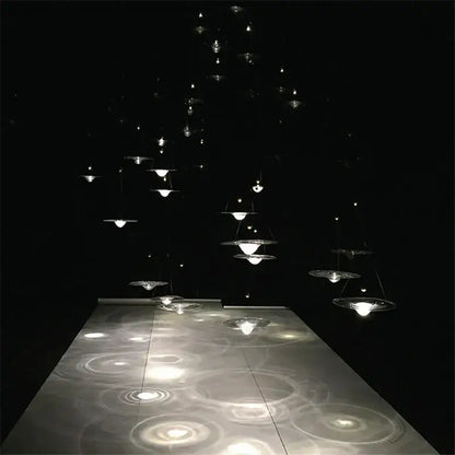 A modern gold and clear glass pendant light with multiple tiers of translucent discs for bedroom decorbites clear glass decor