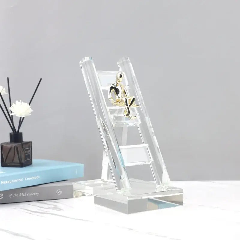 Modern gold and crystal staircase statue featuring a clear decorbites crystal staircase with a gold-toned figure for living room decor
