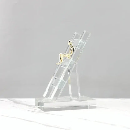 Modern gold and crystal staircase statue featuring a golden figurine on a decorbites crystal staircase base for living room decor