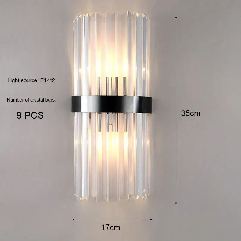 Modern gold and crystal wall light with nine vertical clear crystal bars and a black metal band for decorbites crystal wall decor