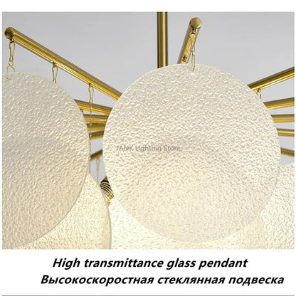 Modern gold led chandelier with frosted textured glass discs hanging from central rod for dining room lighting
