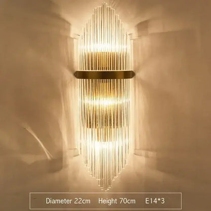 Modern gold and glass led wall lamp with vertical glass rods and brass accent band for bedroom lighting
