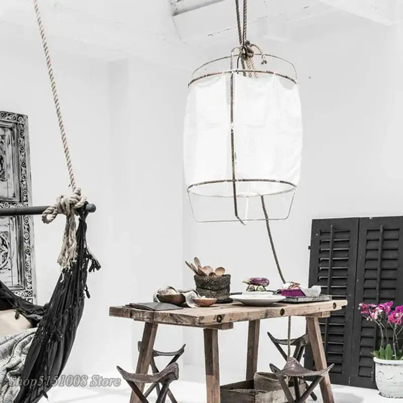 Modern gold and glass pendant light fixture with white cylindrical shade metal frame and rope suspension for dining room decorbites bamboo linen