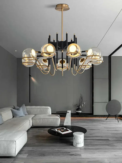 Modern gold and gray glass ceiling chandelier with multiple spherical glass shades and black structural arms for decorbites gray glass decor