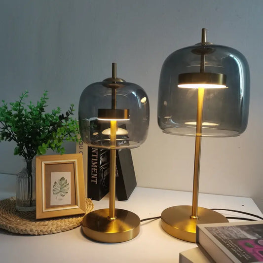 Two modern gold and gray glass table lamps with metal bases and translucent domes for bedroom decorbites decor