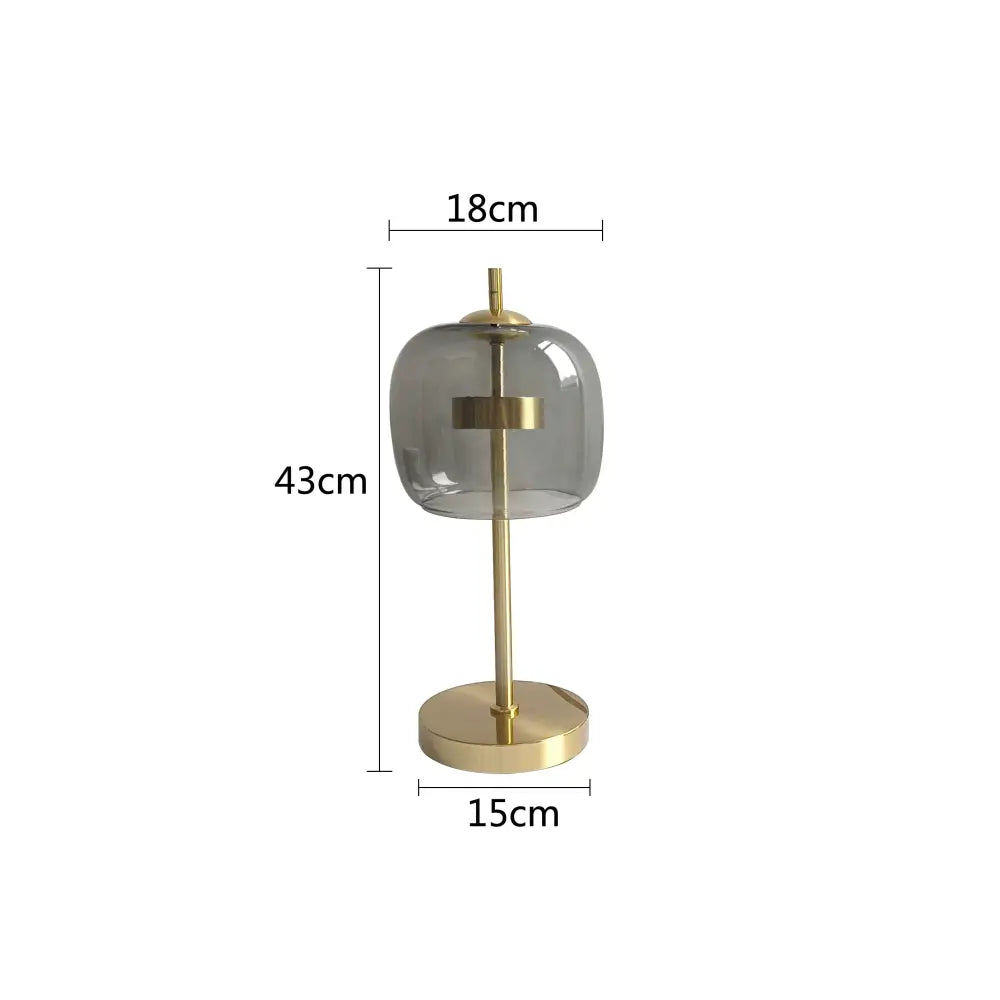 Modern gold and gray glass table lamp set featuring brass finish and translucent gray glass shades for bedroom use