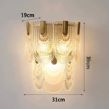 Modern gold and gray glass wall lamp featuring cascading tiers of clear faceted glass panels for living room use