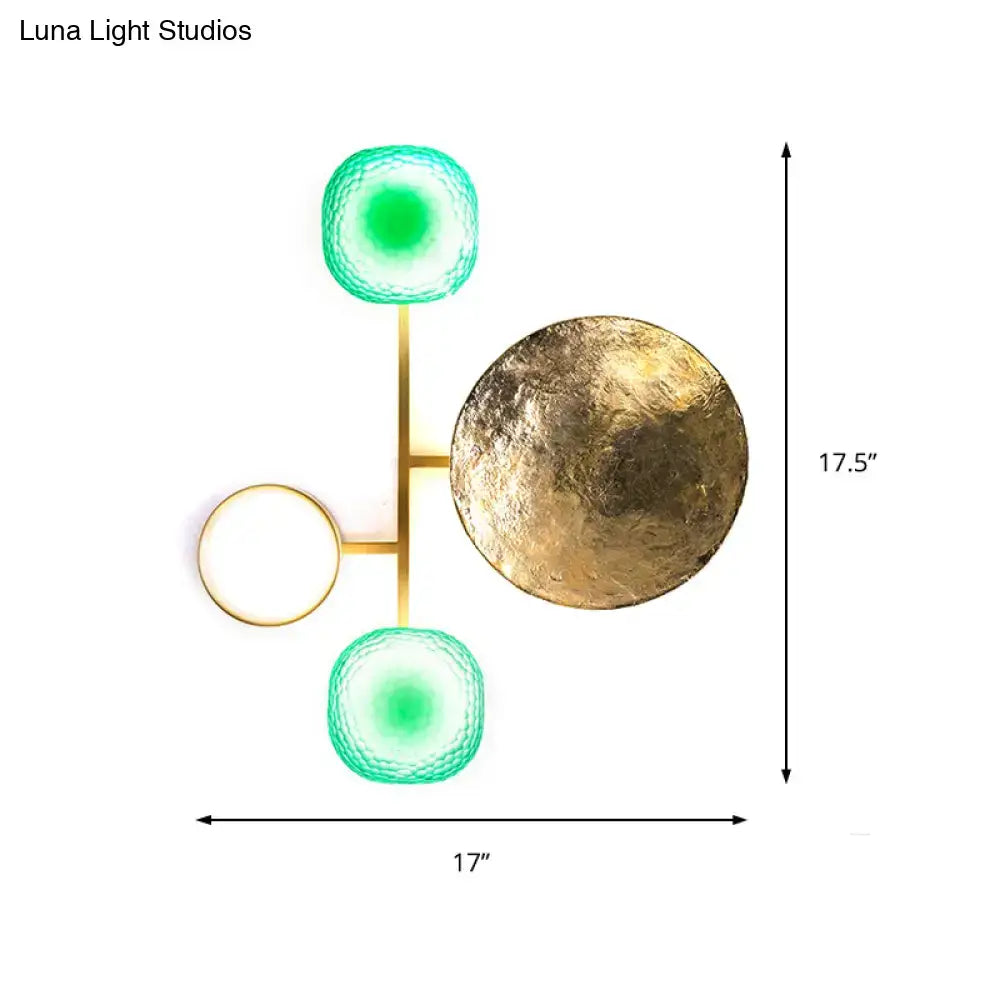 Modern gold and green orbit wall sconce with brushed metal frame and three glass orbs wall lamp for bedroom use