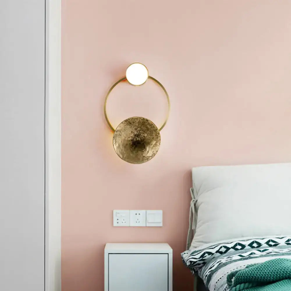 Modern gold and green orbit wall sconce wall lamp with gold-toned circular rings and illuminated top disc for bedroom