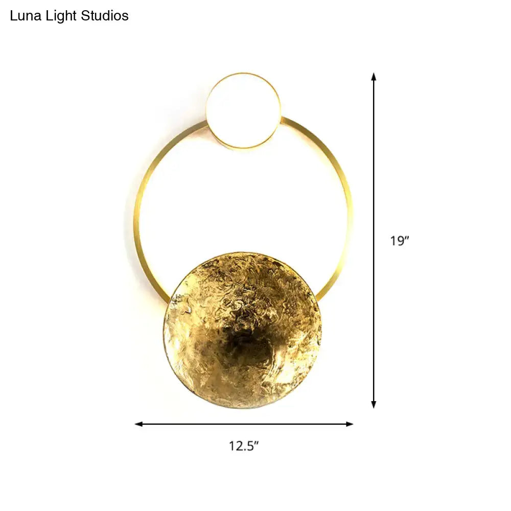 Modern gold and green orbit wall sconce wall lamp with circular frame and textured hammered disc accent for bedroom use
