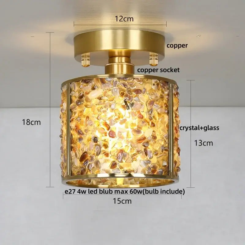 A cylindrical ceiling light with brass copper finish and amber gold clear crystal glass in modern bedroom decorbites copper canopy led