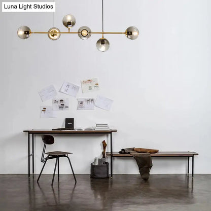 Modern gold and smoke gray linear globe hanging light fixture with spherical glass globes for dining room island 220v-240v
