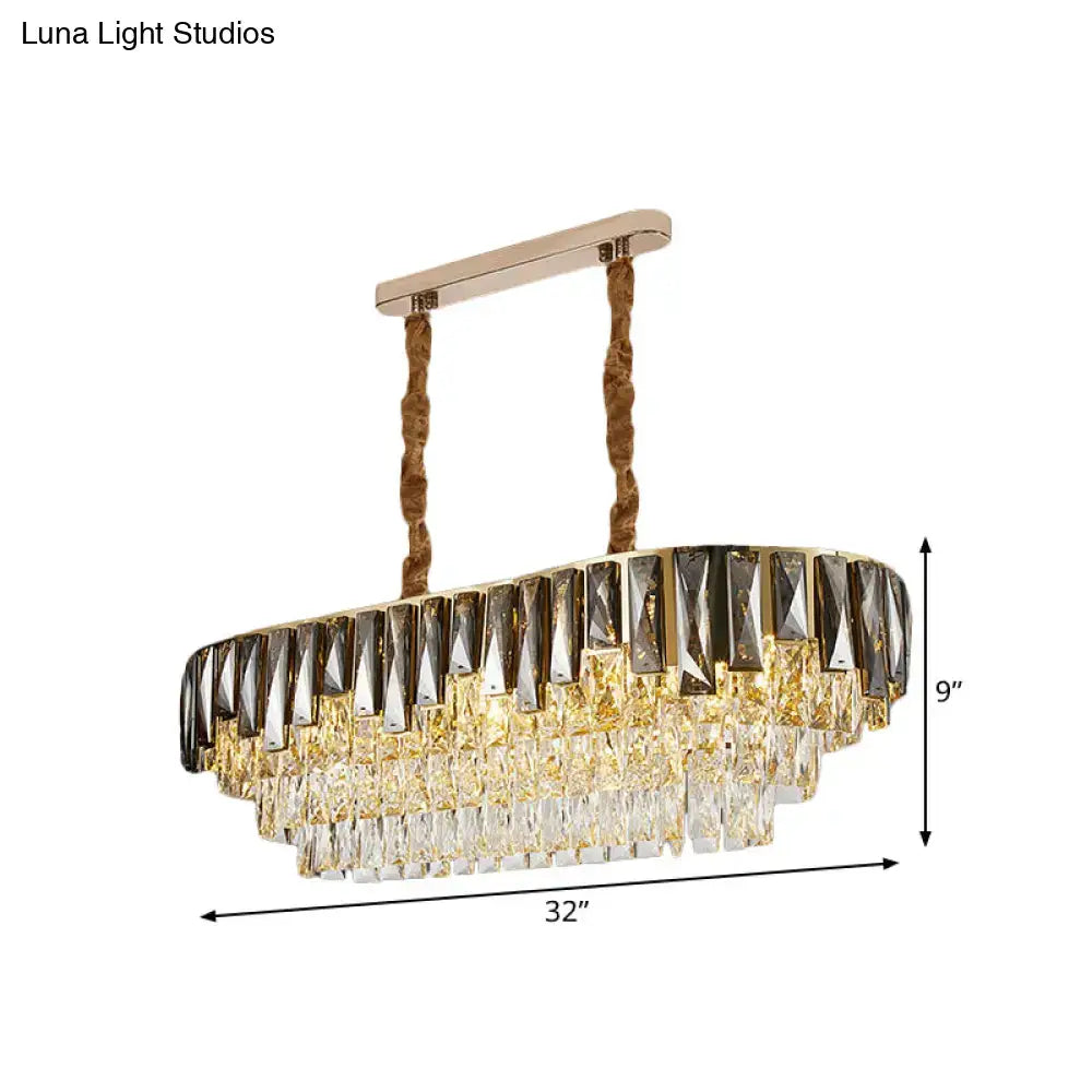 Gold-toned oval chandelier with tiered smoke grey crystal droplets and twisted rope chains for modern ceiling lighting