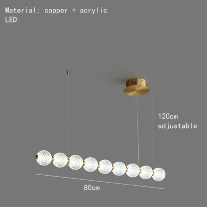 Modern gold and white decorbites acrylic led chandelier with frosted glass spheres and copper accents for living room decor