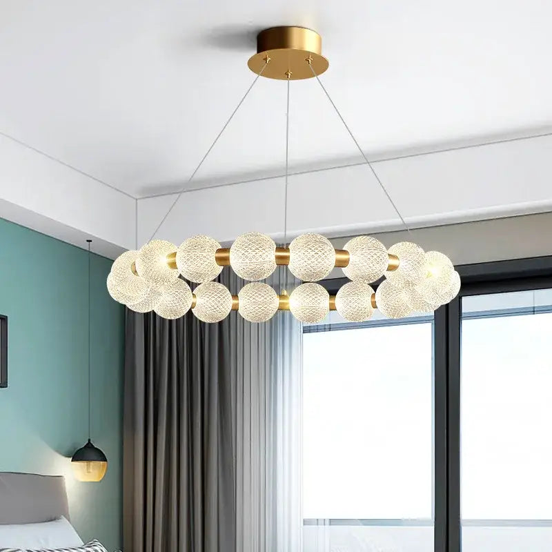 Modern gold and white acrylic led chandelier with frosted glass spheres in a circular design by DecorBites acrylic led