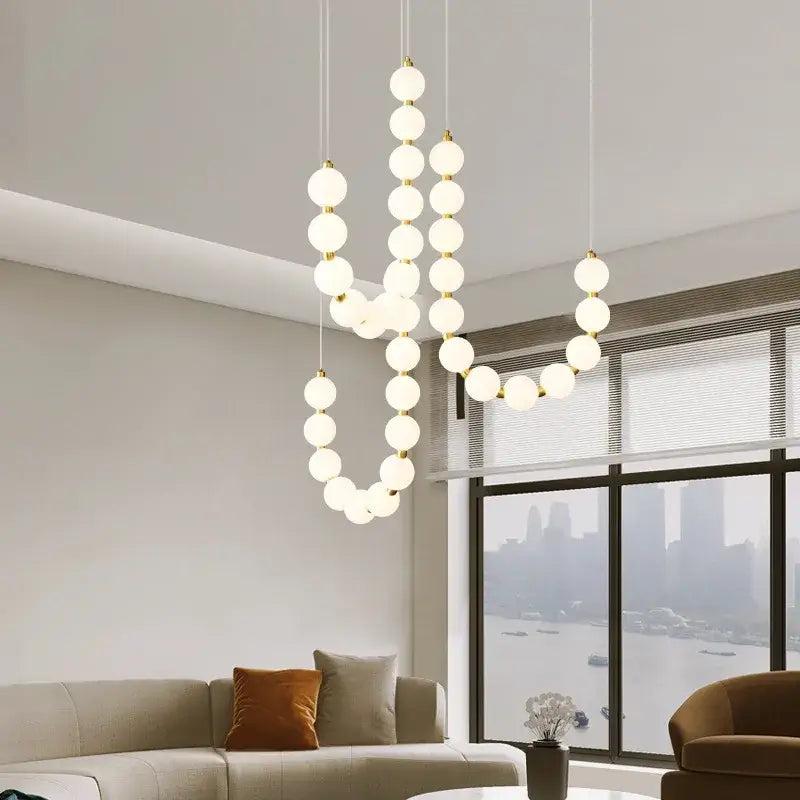 Modern gold and white acrylic led chandelier with frosted glass spheres and metal connectors for living room decorbites acrylic led