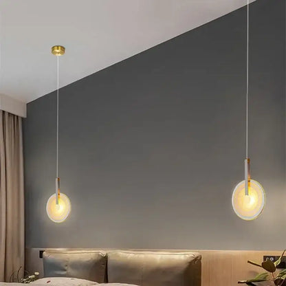 Two minimalist modern gold and white circular glass led chandelier pendant lights with frosted glass shades for dining room decorbites circular glass