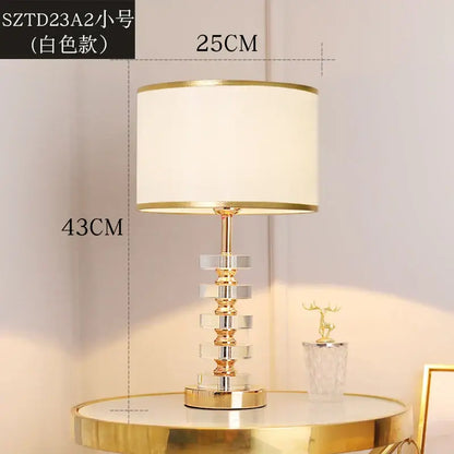 Elegant modern gold and white crystal table lamp with a clear crystal base and white fabric shade for bedroom decorbites crystal table lamp
