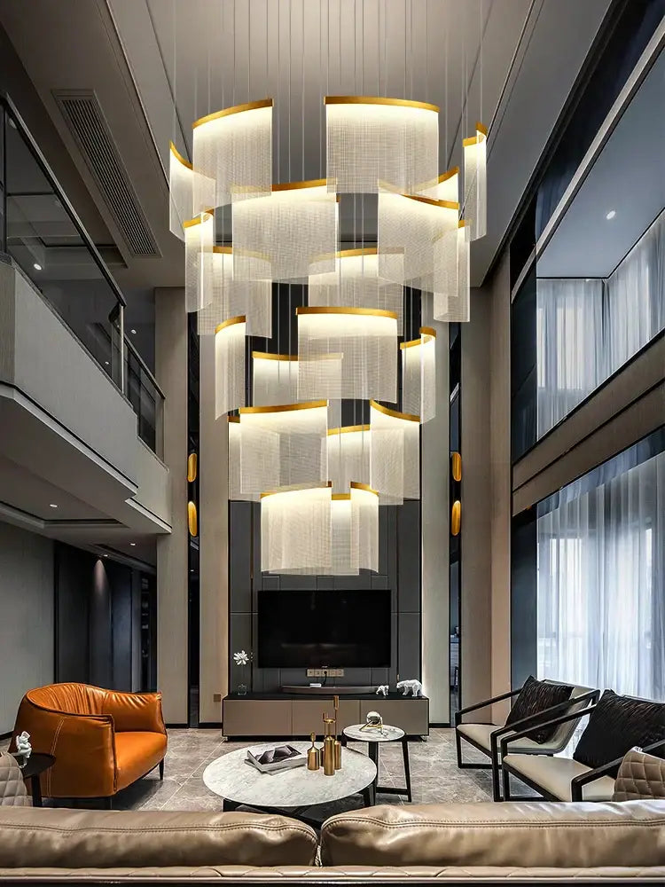 A modern decorbites acrylic led chandelier with layered white panels and gold accents for living room decor