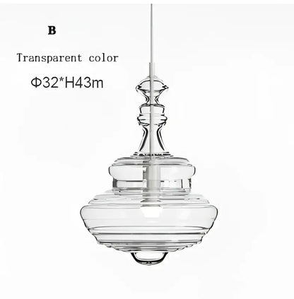 Transparent glass pendant light with tiered sculptural design and slender cord in modern gold and white decorbites glass chandelier