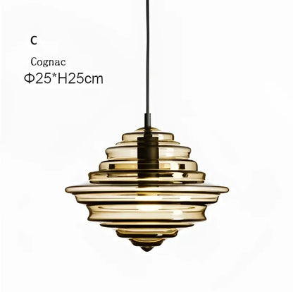 Modern gold and white decorbites glass chandelier featuring a cognac-colored glass pendant light with tiered rings